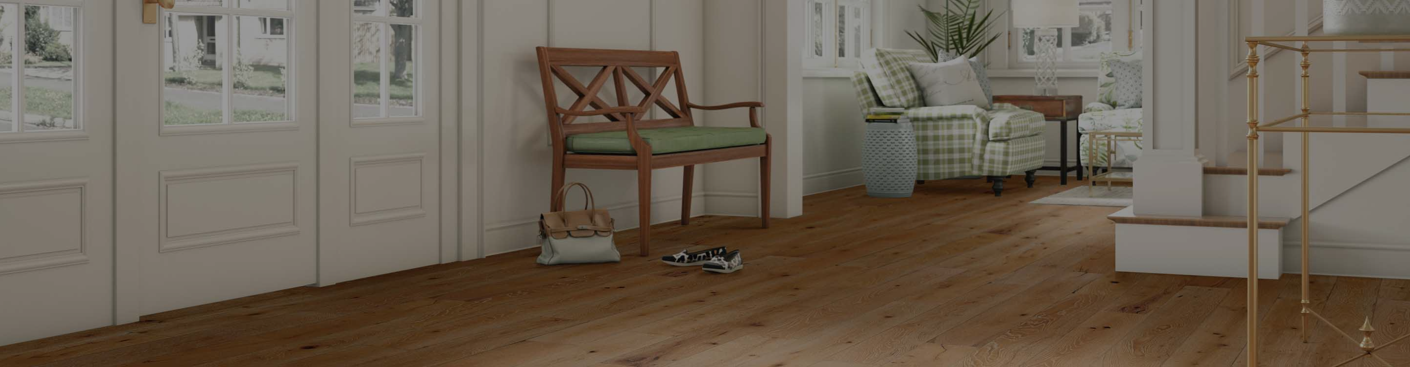 hardwood flooring in entryway with stairs and sitting area